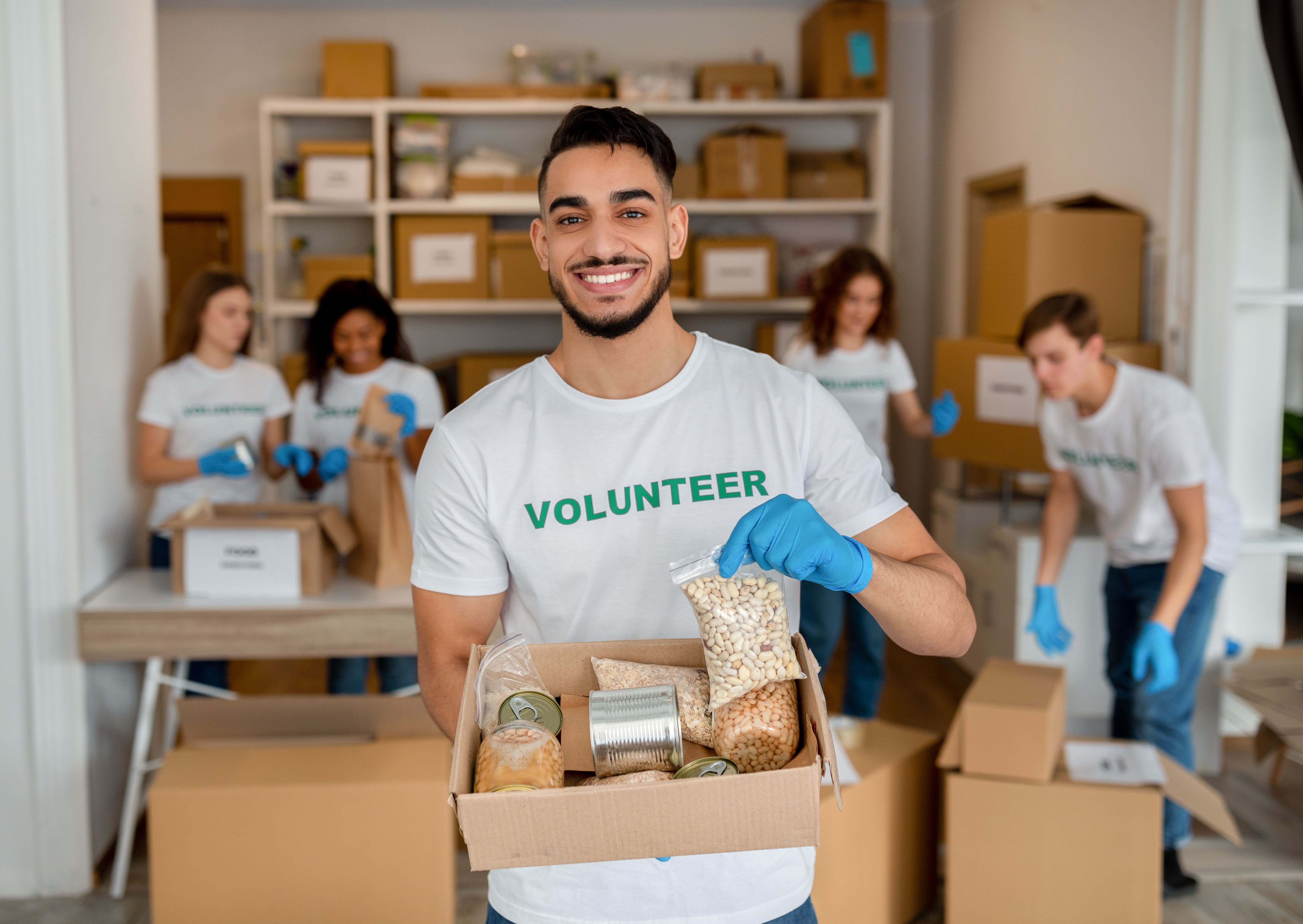 young-arab-volunteer-working-at-charity-center-ho-2021-11-04-21-38-46-utc-min